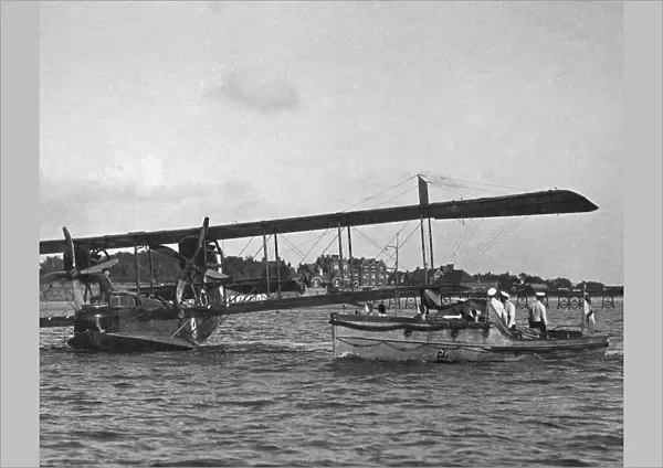 The 'ground crew'approach a flying boat, 1918