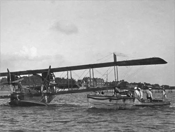 The 'ground crew'approach a flying boat, 1918