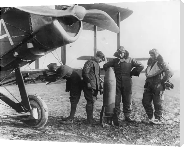 Aircrew of 27 Squadron examine a 230lb bomb