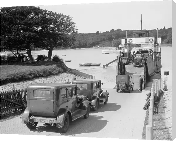 Cars and motorcycles arriving on board the ferry at Fishbourne, 1932