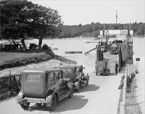 Cars and motorcycles arriving on board the ferry at Fishbourne, 1932