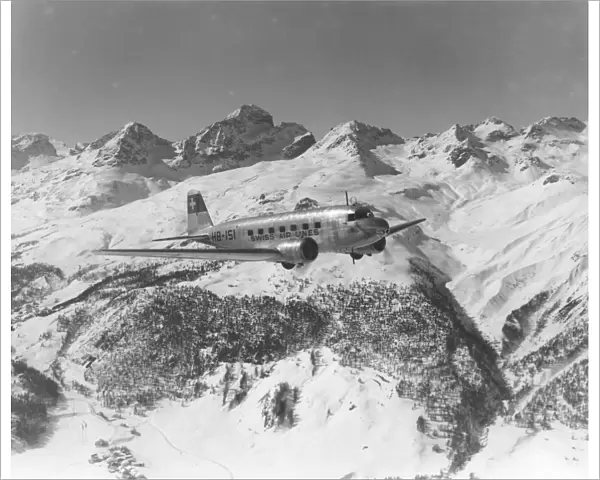 A DC-2 of Swissair, flying near St Moritz, Switzerland, 1938