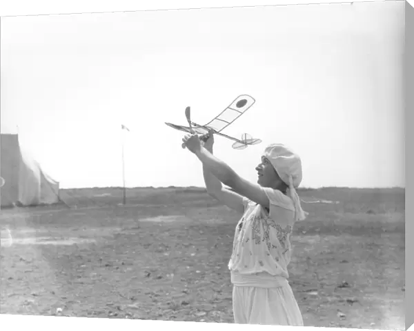 Woman with model aeroplane