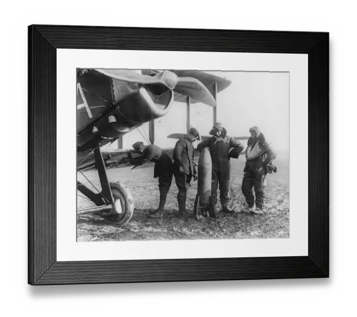 Framed Print : Aircrew of 27 Squadron examine a 230lb bomb
