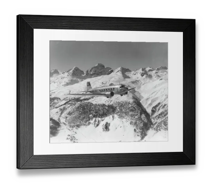 Framed Print : A DC-2 of Swissair, flying near St Moritz, Switzerland, 1938 Framed Print : A DC-2 of Swissair, flying near St Moritz, Switzerland, 1938