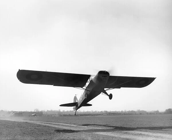 Auster IV. British Taylorcraft Auster IV (MT225) taking off, Rearsby, 1944