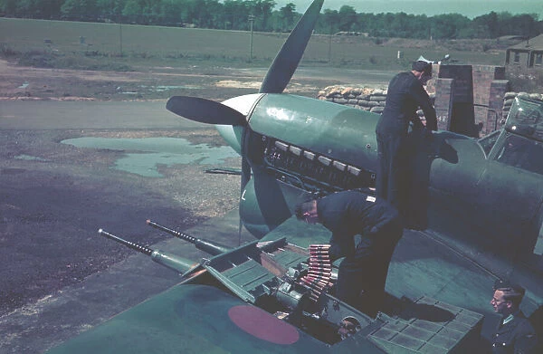 Hawker Typhoon. Armourers reloading the Hispano cannons of a Hawker Typhoon