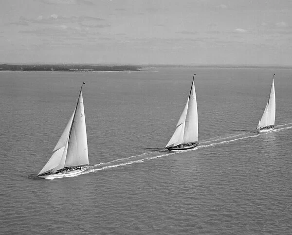 Racing Yachts. J Class yacht Shamrock V leads Britannia and Velsheda, Cowes Regatta 1933