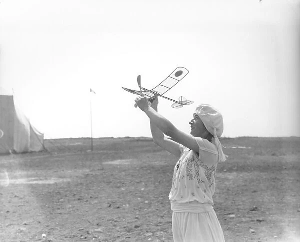 Woman with model aeroplane