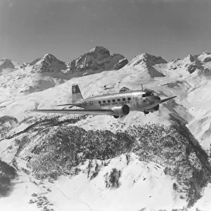 A DC-2 of Swissair, flying near St Moritz, Switzerland, 1938