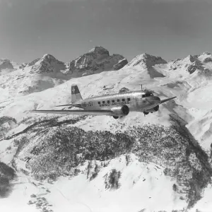 A DC-2 of Swissair, flying near St Moritz, Switzerland, 1938