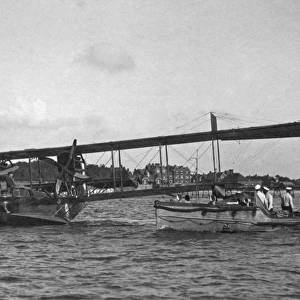 The "ground crew"approach a flying boat, 1918
