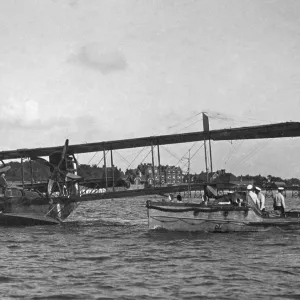 The "ground crew"approach a flying boat, 1918