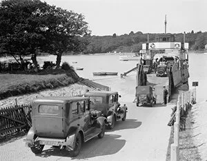 Travel Gallery: Cars and motorcycles arriving on board the ferry at Fishbourne, 1932