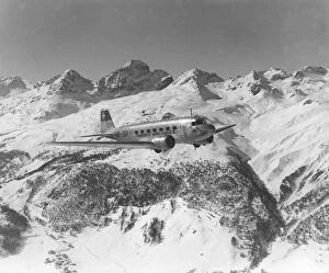 Travel Gallery: A DC-2 of Swissair, flying near St Moritz, Switzerland, 1938