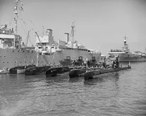 Images Dated 25th September 2009: Submarines with their depot ship